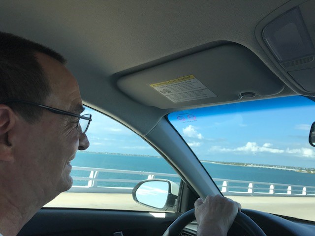 Man driving to Sanibel Island, Florida